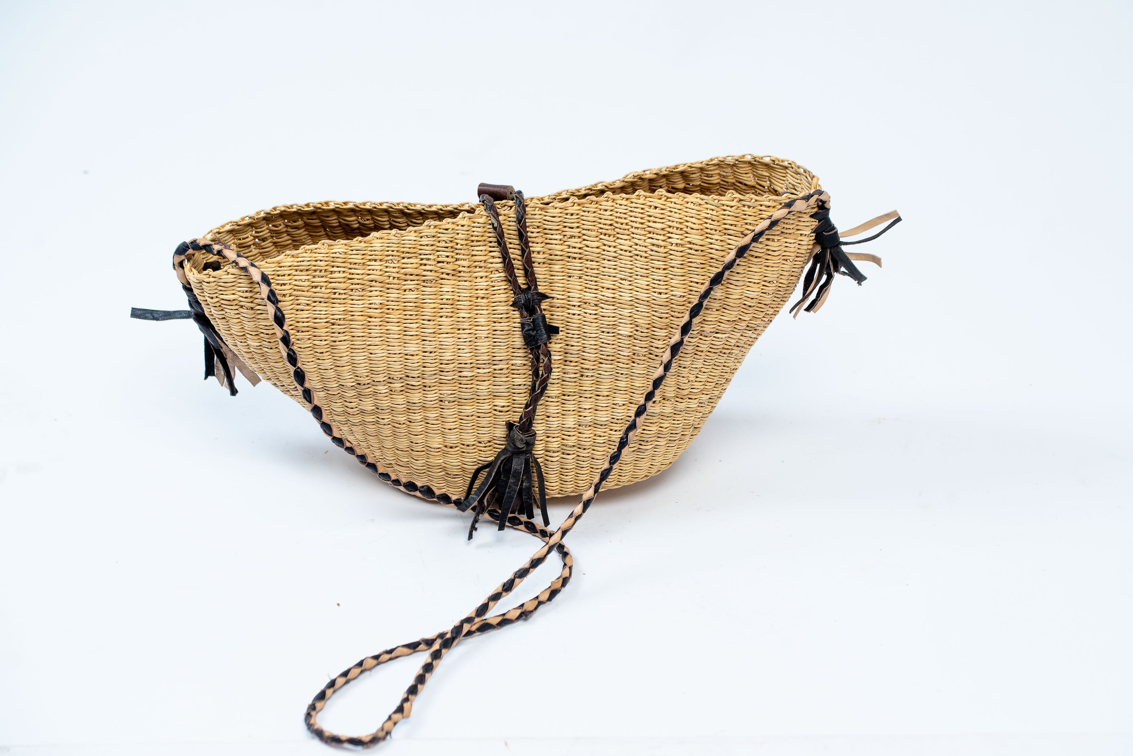 Handwoven Natural Straw Crescent Crossbody Bag – Black Leather Tassels