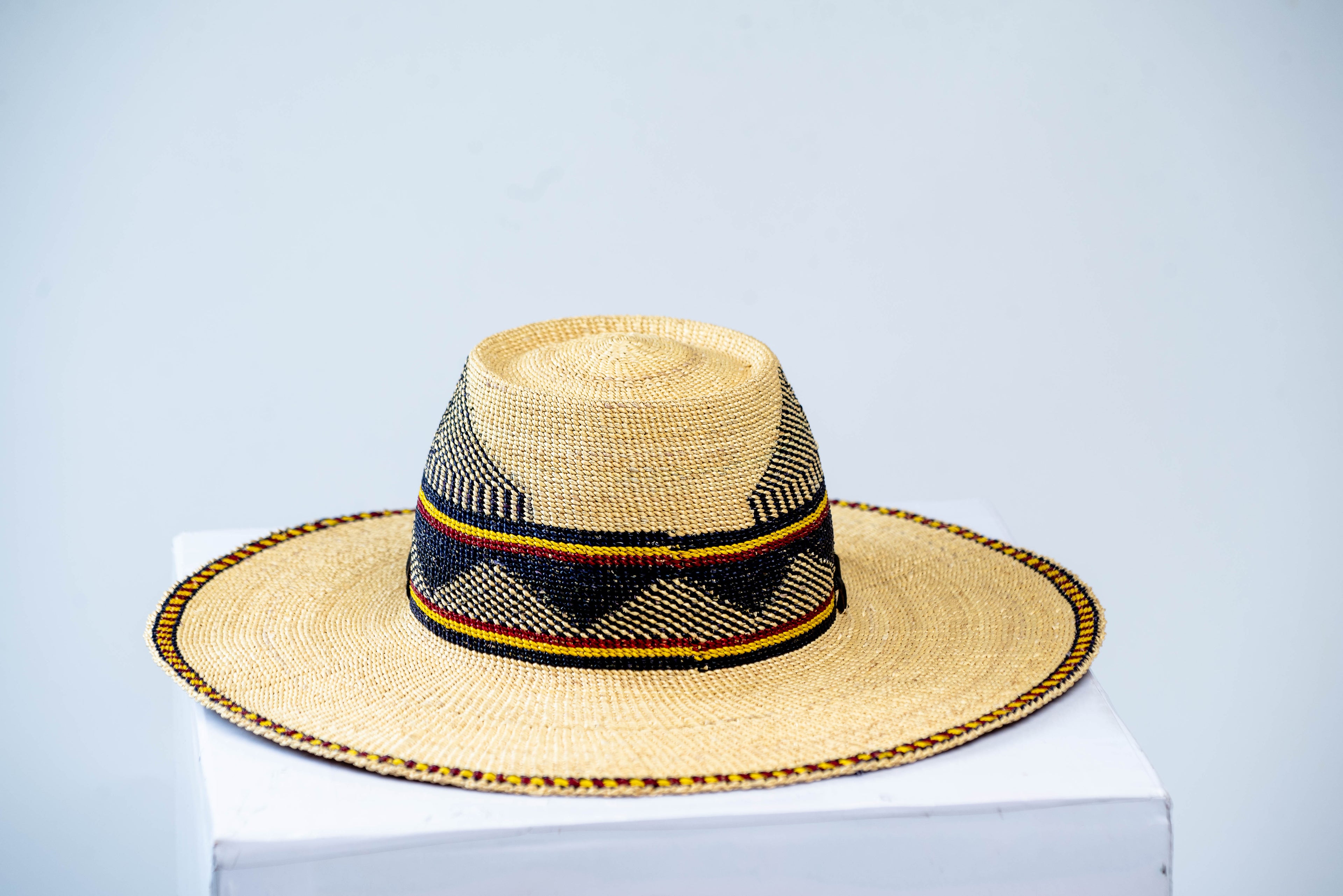 Handwoven Natural Straw Bolga Fedora Sun Hat – Navy, Yellow & Red Geometric Band