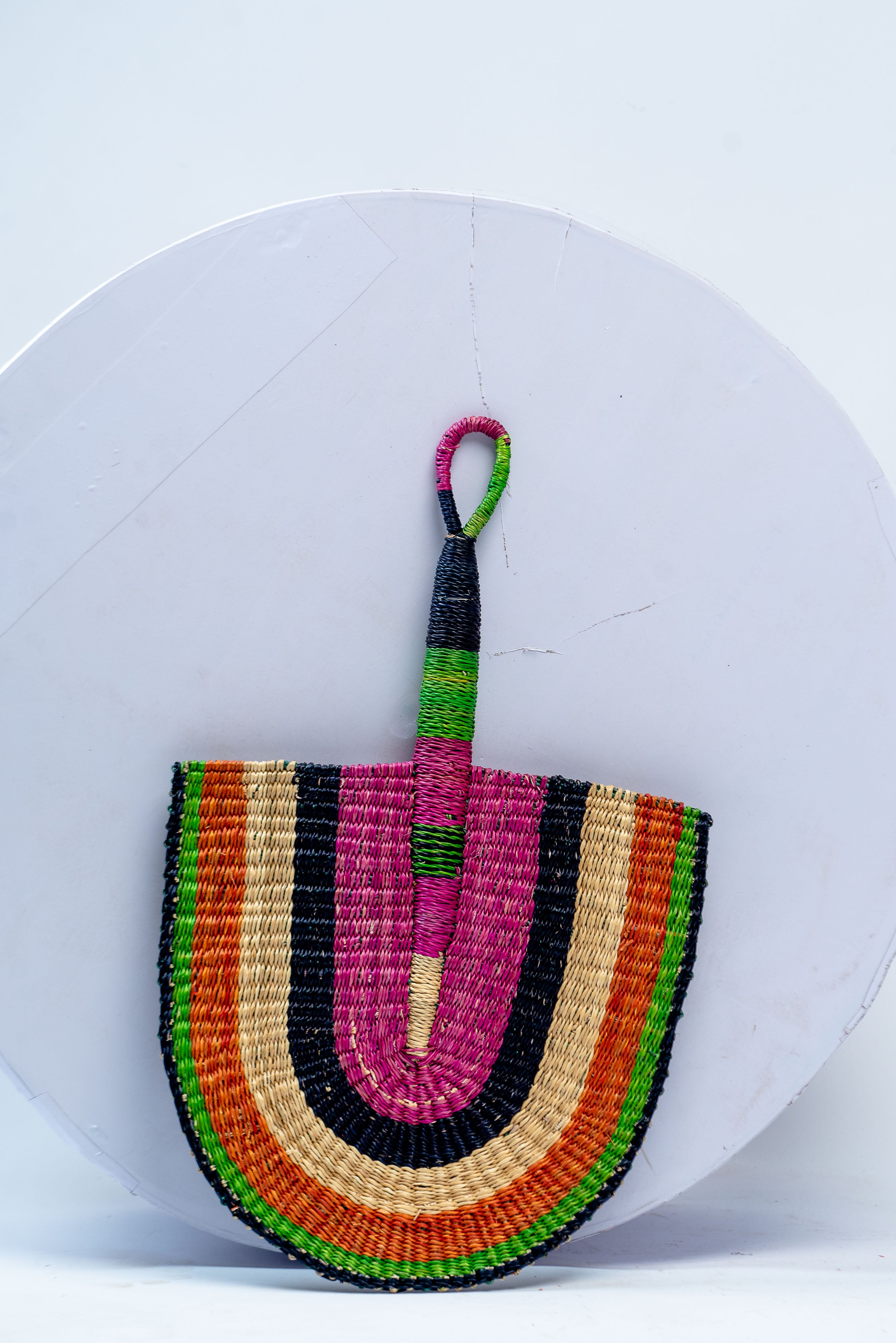 Handwoven Bolga Rainbow Fan – Magenta, Orange, Green & Black Concentric Stripes