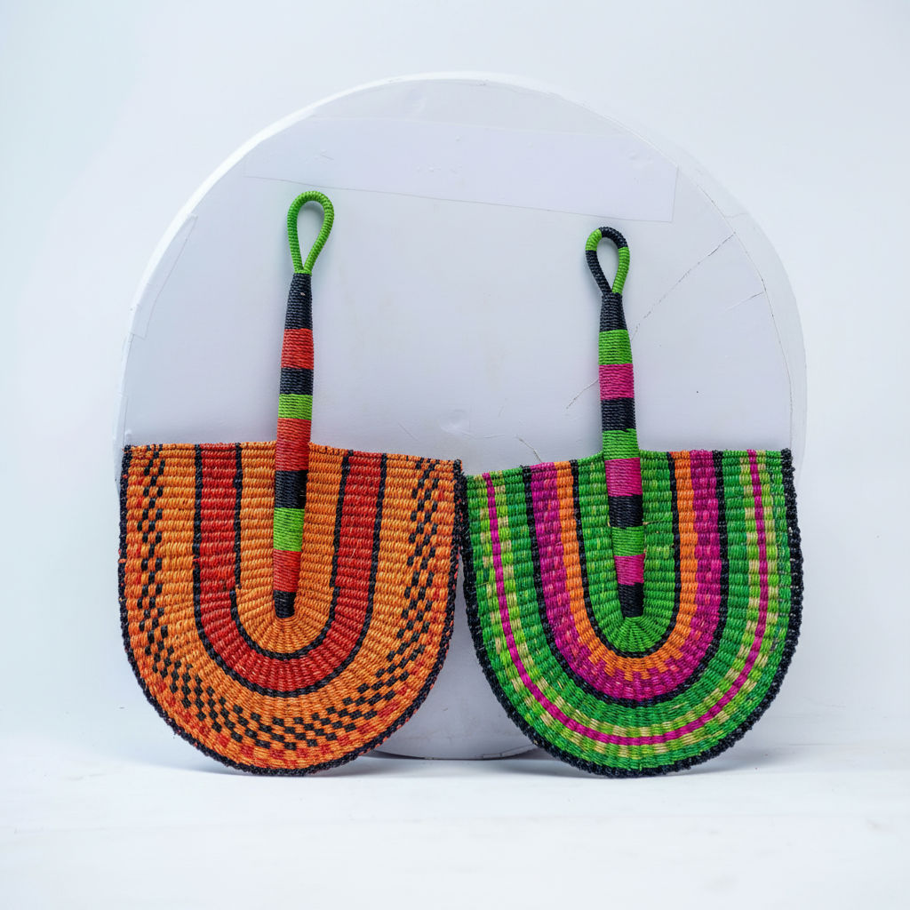 Two handwoven Bolga checkerboard fans side by side, product view