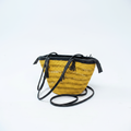 Handwoven golden yellow basket bag, angled product view