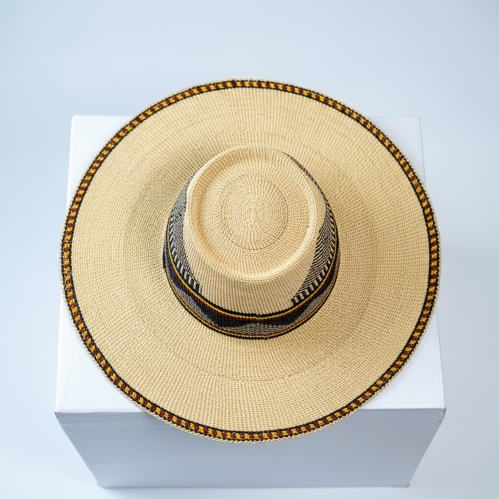 Handwoven Bolga fedora sun hat, top-down view showing natural straw crown