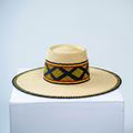 Handwoven Bolga fedora sun hat with navy and yellow band, angled product view