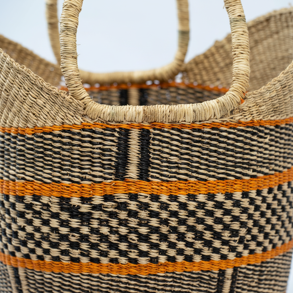 Close-up of black and natural checkerboard weave with orange stripe detail